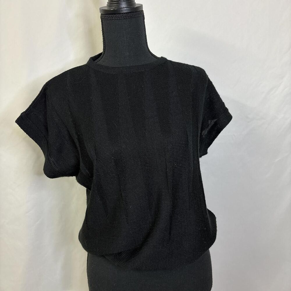 Black short sleeve knit top with a triangle knit pattern